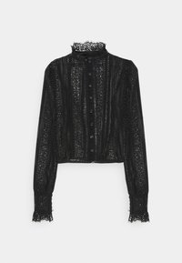 Blouse en dentelle noire avec un col à volants, des manches longues et une fermeture à boutons. Présente des motifs complexes et un tissu texturé dans un design court.