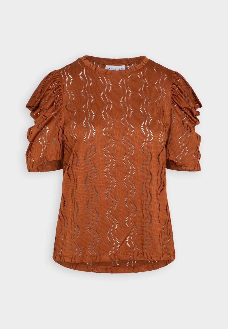 Blouse orange rouille à manches courtes en tissu œillet à motif ondulé avec manches ballon à volants, col rond et ourlet droit.