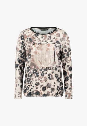 Leopard print long-sleeve sweatshirt in soft fabric with black trim. Center features a square design with text "GLITTER" and "SPARKLE."