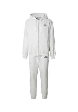White hooded zip-up jacket and matching pants with elastic cuffs, featuring small black Sergio Tacchini logos on chest and thigh.