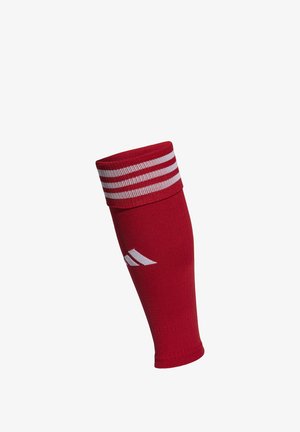 Manchette de sport en coton rouge avec un poignet à rayures blanches, et un accent de logo blanc sur le côté. Ajustée et avec une texture lisse.