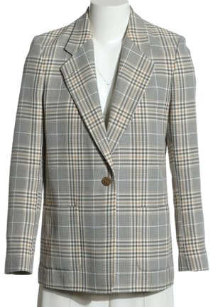 Veste à carreaux grise à un bouton avec des accents beiges, revers crantés et poches avant sur un buste de mannequin blanc.