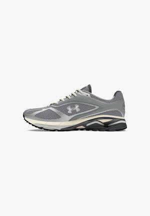 Gray athletic shoe with mesh fabric upper, rubber sole, and cream accents. Features rounded toe and distinct cushioning in the sole design.
