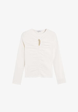 Long-sleeve white top with a rounded neckline, front keyhole detail, and ruched texture along the center. Soft, stretchy fabric.