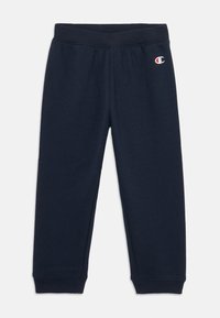 Donkerblauwe joggingbroek van een katoenmix. Elastische tailleband, aansluitende boorden en een klein logo-opdruk op het bovenste gedeelte van het linkerbeen. Zachte textuur.