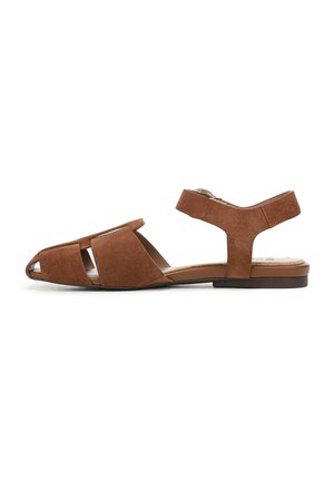 Brown suede sandals featuring an open toe, crisscross design, ankle strap, and flat sole. Smooth texture with no visible hardware.