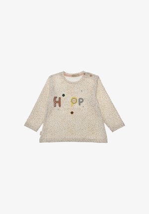Long-sleeve beige toddler shirt with light brown leopard spots and colorful "HAPPY" letters on front with small flower accents.
