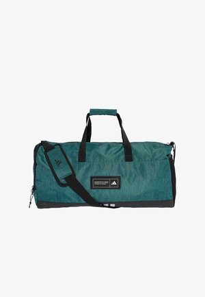Teal duffel bag with black accents, top handles, adjustable shoulder strap, zip closure, and front logo patch. Textured, durable material.