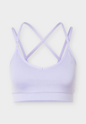 Brassière de sport violet clair avec fines bretelles croisées et une large bande en bas, présentée à plat sur un fond blanc.