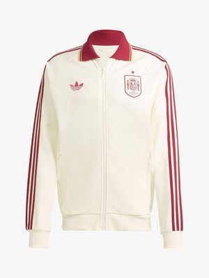 Weißes Sportjacke mit Reißverschluss, roten Streifen an den Ärmeln, rotem Kragen, Adidas-Logo auf der linken Brust und dem Emblem der spanischen Nationalmannschaft auf der rechten Brust.