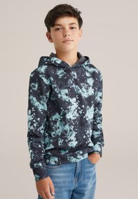Felpa con cappuccio di un blu navy scuro con motivo a schizzi color acquamarina chiara. Realizzata in tessuto morbido con vestibilità rilassata e tasca a marsupio frontale.