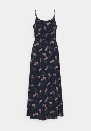 Robe longue fleurie en tissu bleu marine avec un motif floral rose et vert. Elle possède des bretelles fines réglables et une taille cintrée.