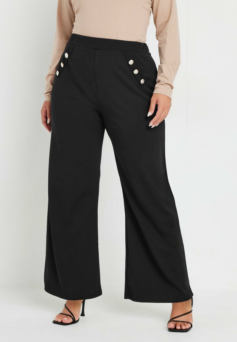Svarta vida byxor med hög midja, med dekorativa knappar på sidorna. Slät tyg med skräddarsydd passform.