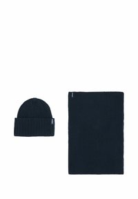 Knitted dark navy beanie with a folded cuff and matching rectangular scarf, both featuring a ribbed texture and subtle logo tag.