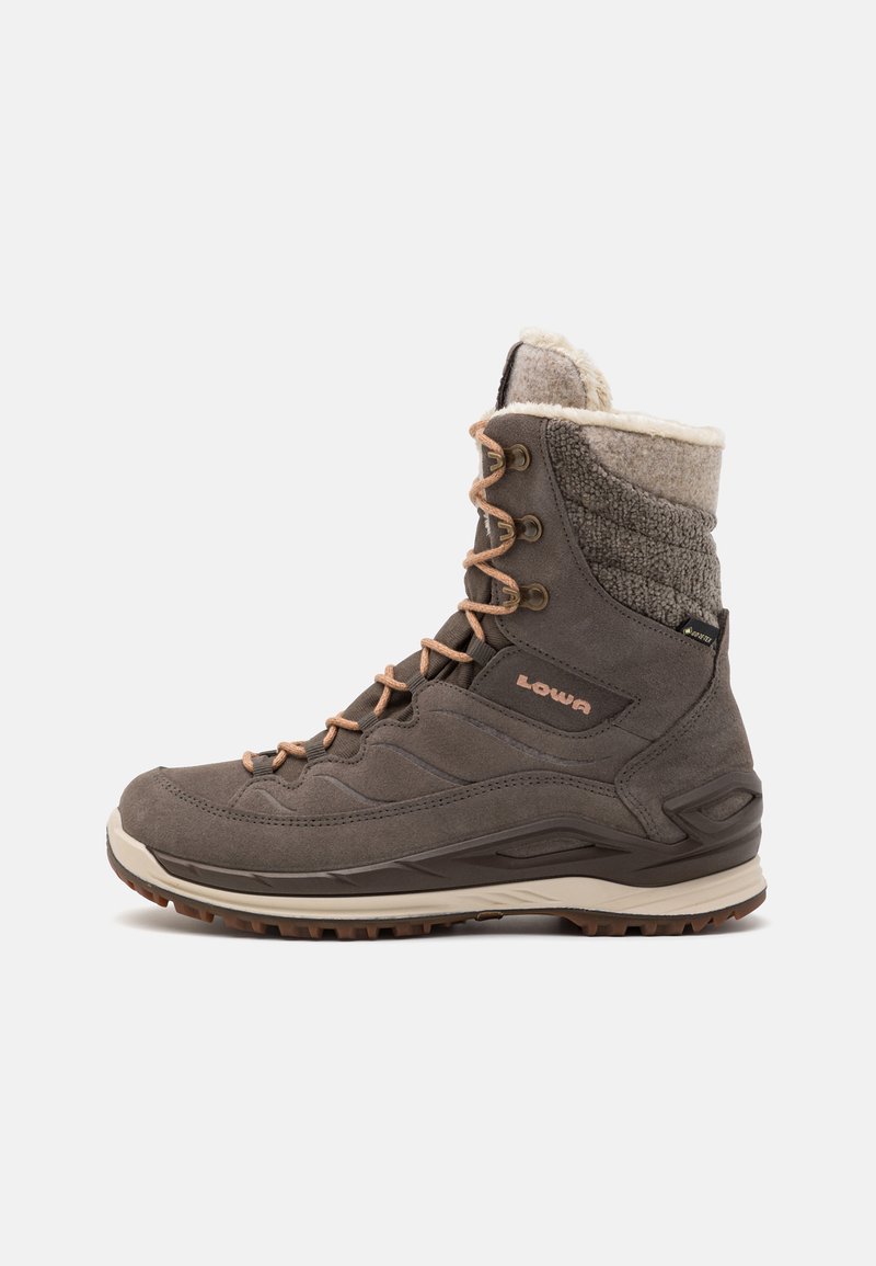 Brown suede hiking boot with a textured gray fabric cuff, orange laces, and a rugged sole. Features a cushioned collar for comfort.