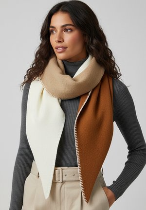 Color-blocked scarf featuring a cream, beige, and brown design. Soft texture with a triangular shape and stitched edges, worn over a gray top.