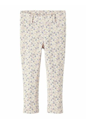 Beige Kinderhose mit durchgehendem weißen und gelben Gänseblümchenmuster und blauen Blättern, mit Gürtelschlaufen und Fronttaschen.