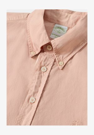 Hemd aus leichtem, pinkfarbenem Baumwollstoff mit spitzem Kragen, gesticktenDetails und vier Knopfverschlüssen. Gesticktes Logo auf der Vorderseite.