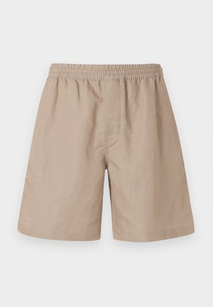 Beige linen shorts with an elastic waistband, featuring a relaxed fit, side pockets, and a smooth texture. No visible patterns or accents.