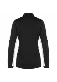 Polo shirt nero a maniche lunghe con colletto, caratterizzato da pannelli laterali bianchi. Tessuto morbido con design aderente e orlo dritto.