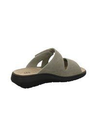 Open-toe slip-on sandal with beige suede upper, cushioned insole, and black rubber sole, angled to show side and back detail.