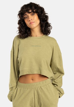 Olive green cropped sweatshirt with long sleeves, featuring a textured fabric and embroidered logo detail on the chest.