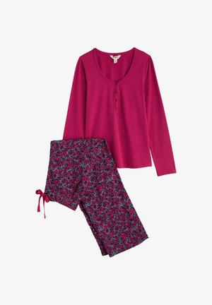 Top a maniche lunghe di un rosa intenso con scollatura a V con bottoni e pantaloni a fantasia blu navy con dettagli floreali rosa e verdi. Tessuto morbido, vestibilità casual.