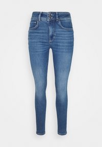 Skinny jeans in medium wash denim, featuring a high waist, two front pockets, and a button closure with a zip fly. Subtle fading detail.