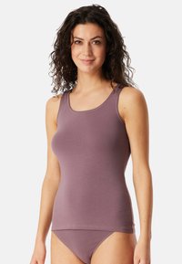 Purple tank top with a square neckline and smooth texture, paired with matching bikini bottoms. Features fine stitching along the edges.