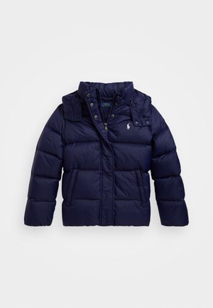 Navy blue puffer jacket with quilted texture, high collar, zip and button closure, side pockets, and small logo on the chest.