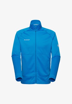 Blue full-zip fleece jacket with high collar, textured horizontal lines, side zip pockets, "Mammut" logo on chest and emblem on left sleeve.