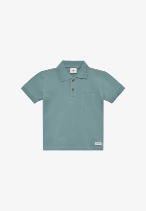 Polo a maniche corte in morbido cotone turchese con collo, tre bottoni marroni e una tasca sul petto. Etichetta sull'orlo.