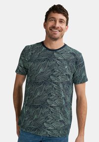Marineblå kortærmet t-shirt med et grønt bladmønster, rund halsudskæring og blødt stof. Casual pasform med et sømløst design.