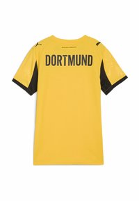 Maglietta gialla a maniche corte con maniche nere. Presenta "DORTMUND" stampato sul retro in caratteri neri in grassetto e a contrasto. Tessuto liscio.
