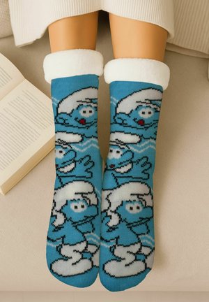 Blue socks featuring a cartoon character design with white accents and fluffy cuffs, knitted with a soft texture.