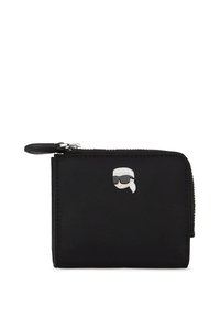 Čierna nylonová peňaženka s postavičkou v striebornom tóne so slnečnými okuliarmi. Zapínanie na zips, minimalistický dizajn, kompaktný tvar.