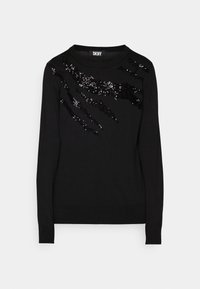 Svart tröja i mjukt tyg med ett mönster där svarta paljetter är placerade i streck över framsidan. Långa ärmar och rund halsringning.