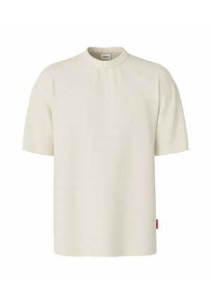Schlichtes hellbeiges T-Shirt mit kurzen Ärmeln, rundem Ausschnitt und dezent geprägtem Markennamen auf der Brust.