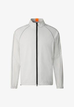 Lysegrå lynlåstrøje med høj krave, sort lynlås, elastiske manchetter og subtile syningsdetaljer på ærmer og skuldre.