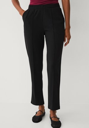 MIT GENÄHTEN FALTEN - Bukser - black