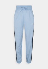Light blue athletic pants with a drawstring waist, black side stripes, and a small black logo near the top left. Soft fabric, tapered fit.