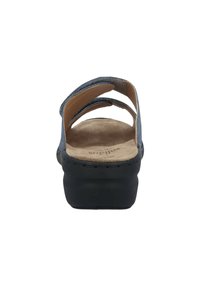Blue fabric sandals with three straps, a contoured light brown footbed, and a black platform sole. Smooth texture with subtle stitching detail.