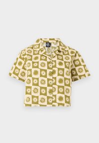 Κοντομάνικο crop πουκάμισο με μπεζ και ελιά καρό σχέδιο που φέρει λογότυπα ήλιου και σπειροειδών σχεδίων.