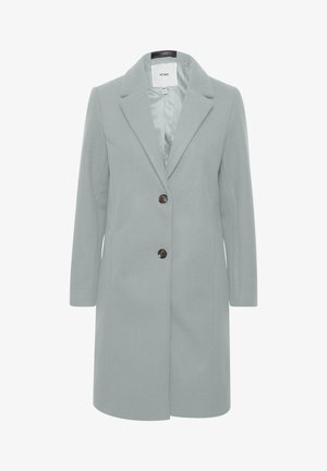 Svetlo siva bunda z izrezanim ovratnikom, dvema rjavima gumboma za zapiranje, dolgimi rokavi in ravno silhueto. Gladka, teksturirana tkanina.