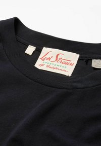 Black cotton t-shirt featuring a ribbed crew neck, with a prominent red and green label reading "Levi Strauss Sportswear, California."