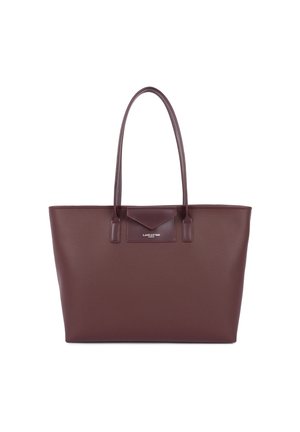 Leather tote bag in deep burgundy with a pebbled texture, flat handles, and a triangular accent. Features a logo detail on the front.