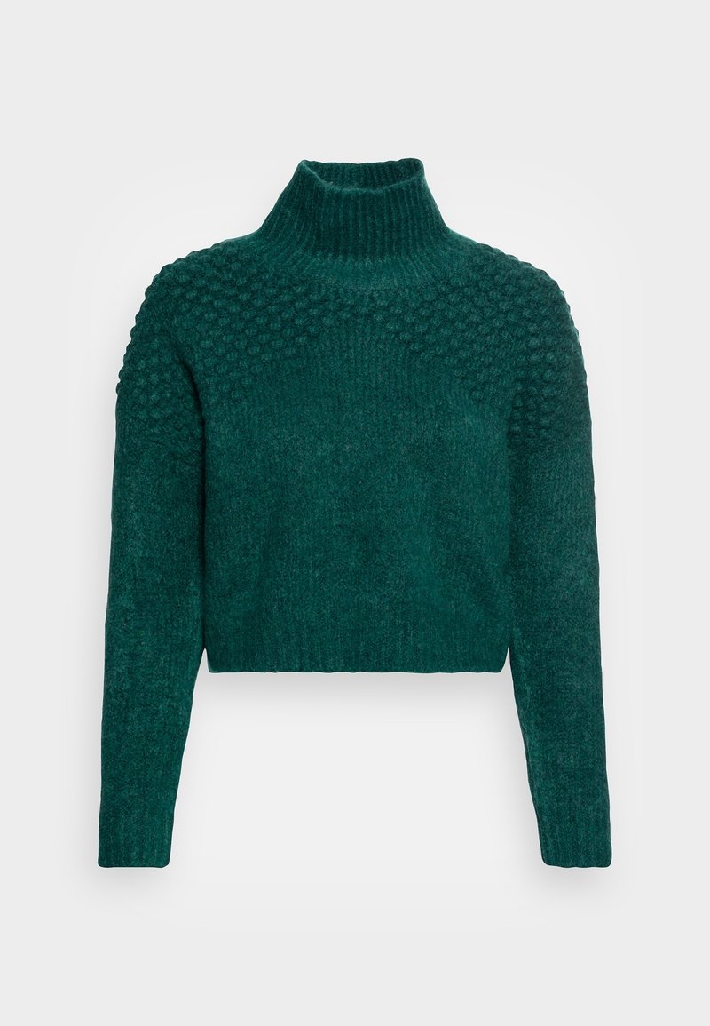 Pull vert foncé en tricot avec motif à boules texturé sur les épaules et la poitrine, col montant côtelé, manches longues et ourlet court.