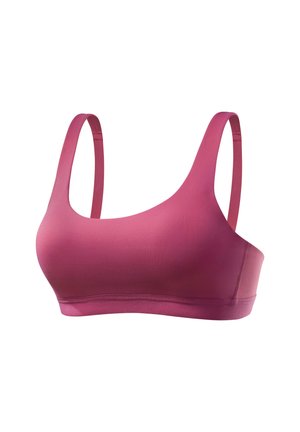 Soft pink sports bra with thin adjustable straps and seamless design, shown on a white background.