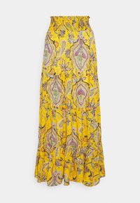Falda maxi amarilla con cintura acampanada, que presenta un estampado de paisley en púrpura, verde y rojo. Dobladillo acampanado con detalles de volantes.