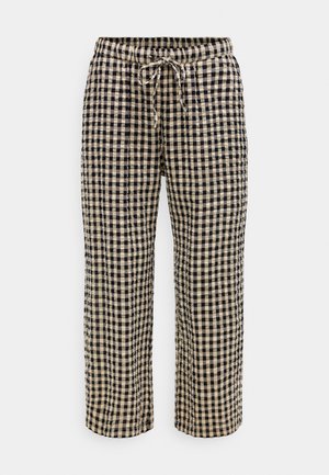 Pantaloni con coulisse a quadri neri e beige, dalla vestibilità ampia, realizzati in tessuto strutturato, mostrati su uno sfondo bianco.